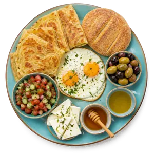 Petit-déjeuner Fassi du Pavé : msemen, batbout, œuf, olives, fromage blanc, miel — Guéliz, Marrakech